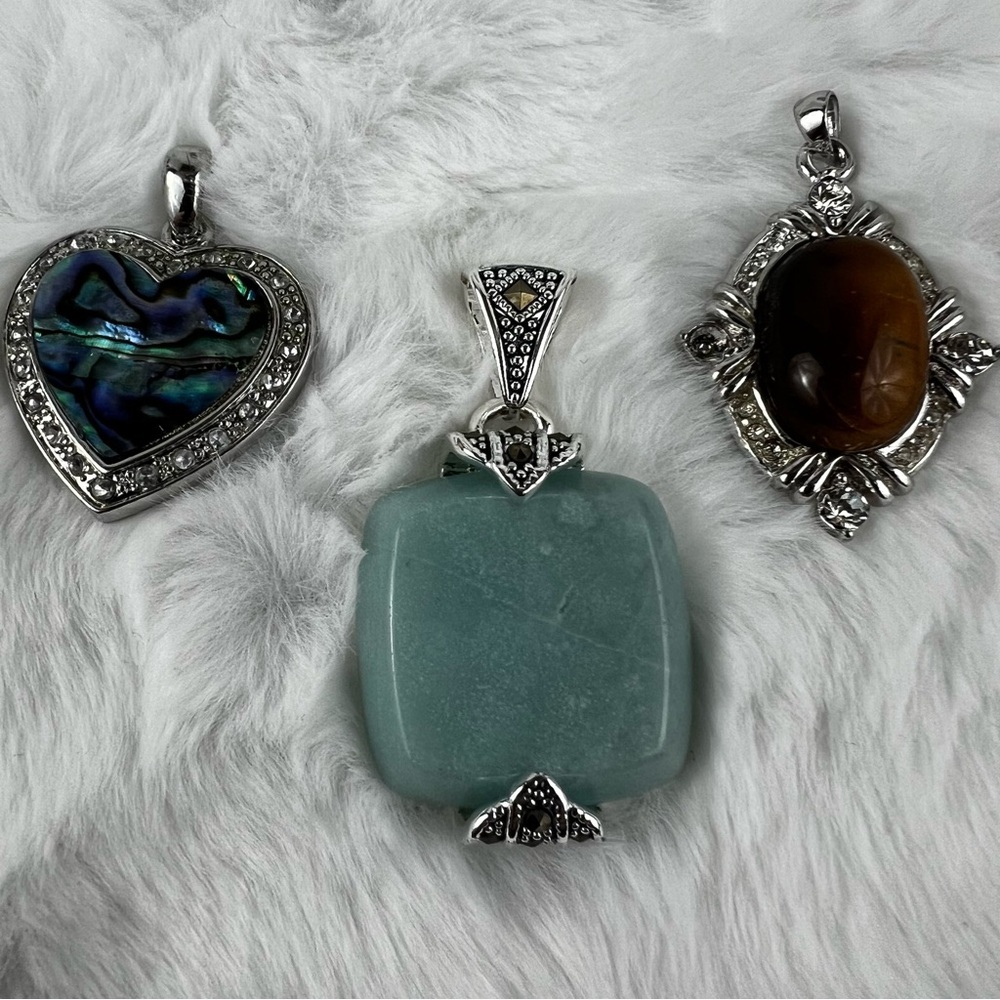 3 Silver Toned Pendants